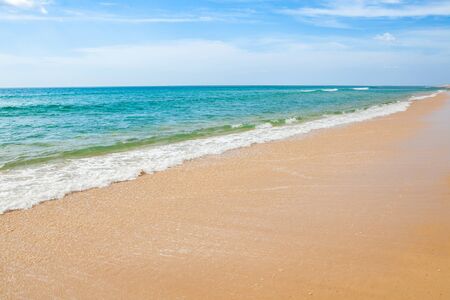 Wave of the sea on the sand beach at Thailand.の写真素材