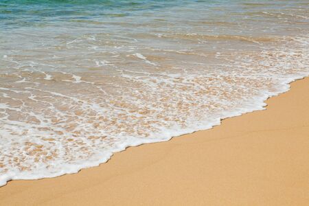 Wave of the sea on the sand beach at Thailand.の写真素材