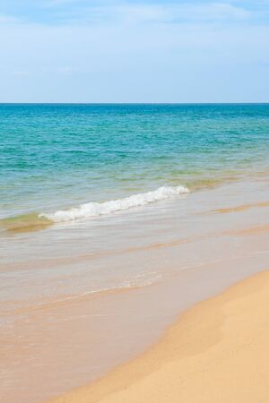 Wave of the sea on the sand beach at Thailand.の写真素材