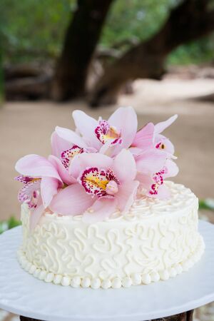 Beautiful of  Wedding Cake with Flowers on Top.の写真素材