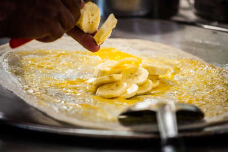 Fried roti with egg and banana,Thailandの写真素材