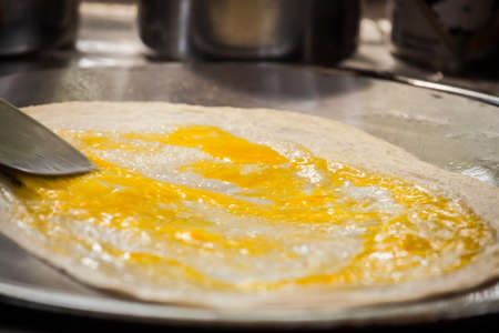 Fried roti with egg and banana,Thailandの写真素材