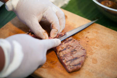 Beef steak on cutting board. (Selective focus)の写真素材