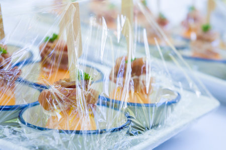 Canape ; Decoration and foods that are wrapped with plastic wrap prepared for the weddingの写真素材