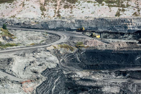 Mining dump trucks working in coalmine , Used as a source of electricity generation in the country.の写真素材