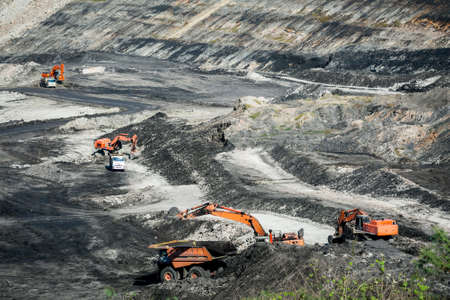 Mining dump trucks working in coalmine , Used as a source of electricity generation in the country.の写真素材