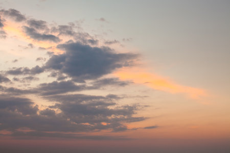background of the sky with clouds at sunsetの写真素材