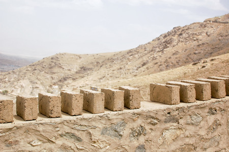Mud bricks used for building a wall on the hillside of Kabul Afghanistanの写真素材