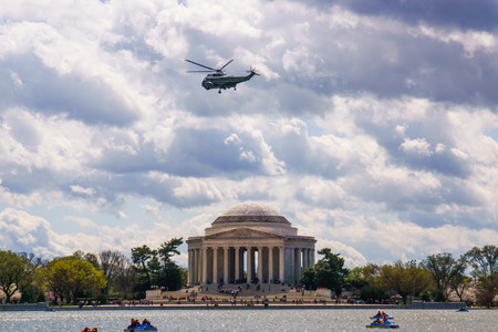 Jefferson Memorial during Cherry Blossom Festival 2016 with paddle boats and Marine One flying overheadのeditorial素材