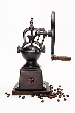 Classic Coffee Grinder with coffee beans on white backgroundの写真素材