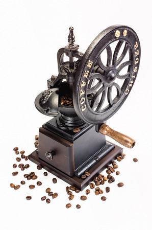 Classic Coffee Grinder with coffee beans on white backgroundの写真素材