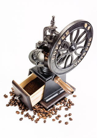 Classic Coffee Grinder with coffee beans on white backgroundの写真素材
