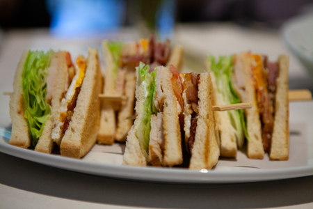 Close up of Club sandwiches by its side. Can see all delicious filling.の写真素材
