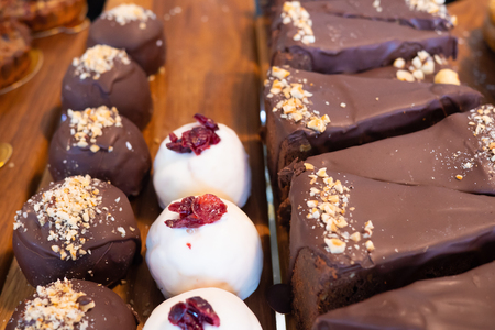 Assortment of delicious and colorful desserts made by pastry chef. All look very tasty and...
