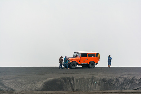 Mt. Bromo , East Java, Indonesia. May 21, 2016. Tourists taking a break after a ride on a jeep around caldera plain and sand dune at Bromo-Tengger-Semeru National Park, a nature reserve since 1919.のeditorial素材