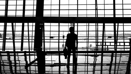 A lonely man waiting someone at the airportの写真素材