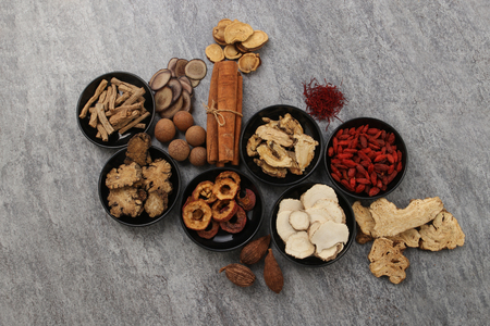 Traditional Chinese Medicine on cement backgroundの写真素材