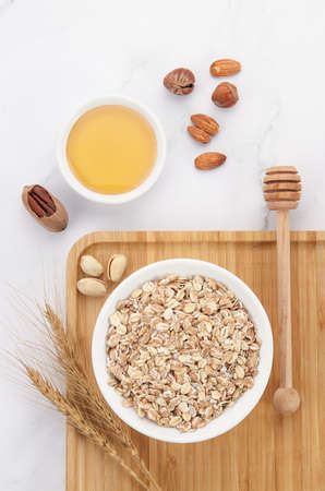 Breakfast consisting of oatmeal and nutsの写真素材