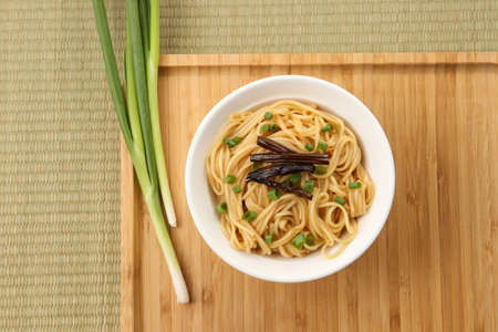 A bowl of scallion noodles