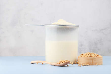 Soy milk and soybeans on the tableの写真素材