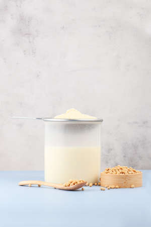 Soy milk and soybeans on the tableの写真素材