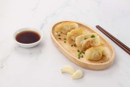 A plate of fried dumplings on the tableの写真素材