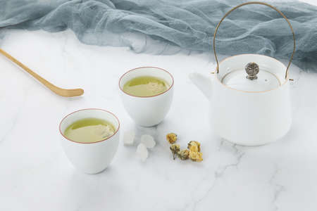 Chrysanthemum tea and tea set on the tableの写真素材