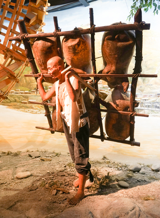 Wax sculpture of a man carrying a sheepskin raftのeditorial素材