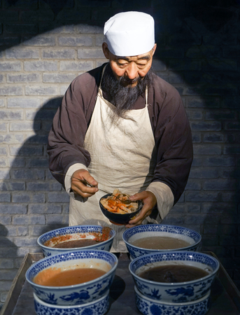 Wax sculpture of a noodle seller in Lanzhouのeditorial素材