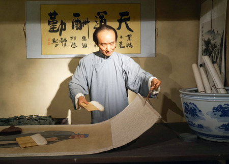 Wax sculpture of a folk in traditional costume paintingのeditorial素材