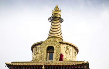Exterior landscape view of a golden stupa under the blue skyの写真素材