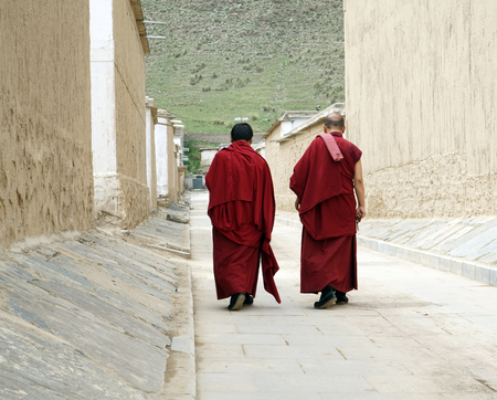 Two monk walking at the Labrang Monasteryのeditorial素材