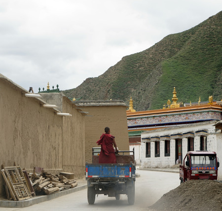 Man riding a tricycle in the Tibet villageのeditorial素材