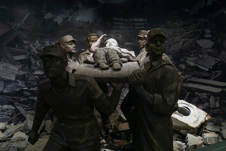 Sculptures of rescuers carrying out an injured childのeditorial素材