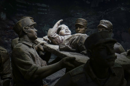 Sculptures of rescuers carrying out an injured childのeditorial素材
