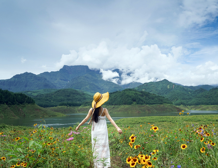 elegant woman with Wawushan mountain flowersの写真素材
