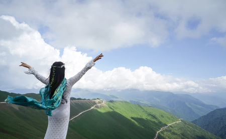 elegant woman with Jiajin Mountain sceneryの写真素材