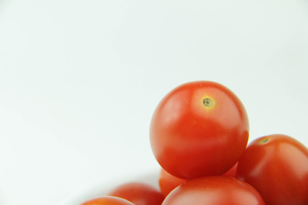 Cherry tomatoes on white backgroundの写真素材