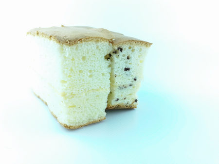 slice fresh baked chiffon cake on white backgroundの写真素材