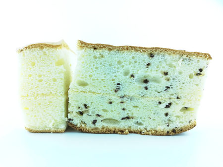 slice fresh baked chiffon cake on white background