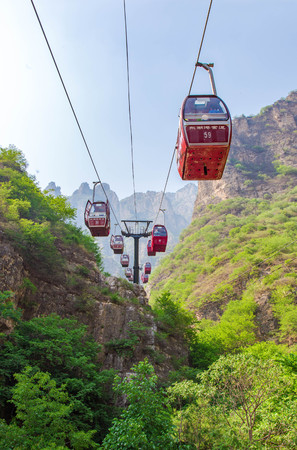 Show of cable cars going through mountainous areaのeditorial素材