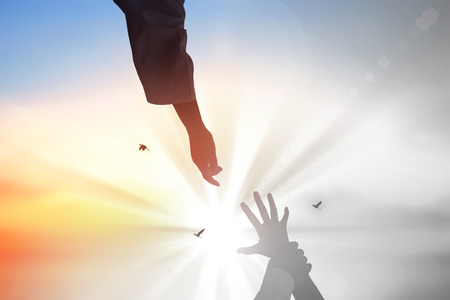 hleping Hands of Jesus Christ silhouetteの写真素材