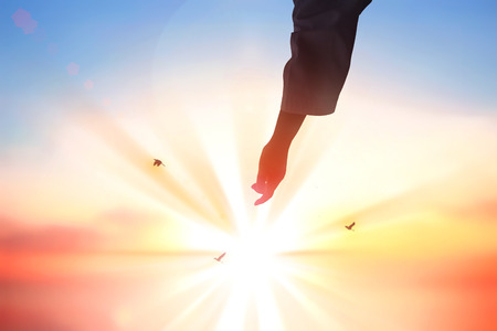 hleping Hands of Jesus Christ silhouetteの写真素材