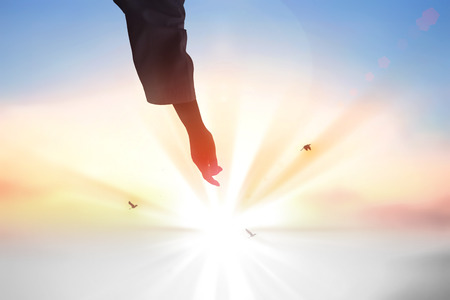 hleping Hands of Jesus Christ silhouetteの写真素材
