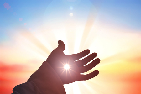 Hands of Jesus Christ silhouetteの写真素材
