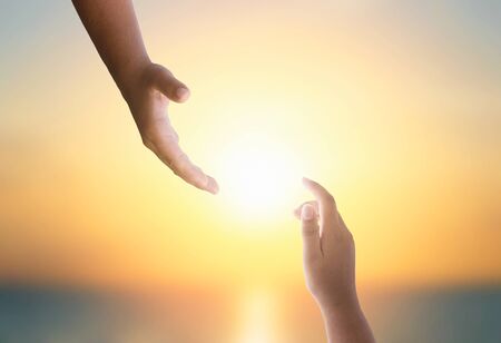 international day of peace concept: Silhouette of hands helpの写真素材