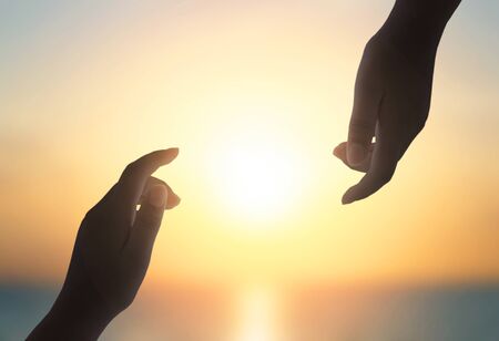 international day of peace concept: Silhouette of hands helpの写真素材