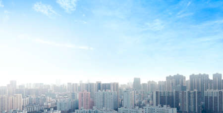 World Cities Day concept: real estate modern city urban skyline under blue skyの写真素材