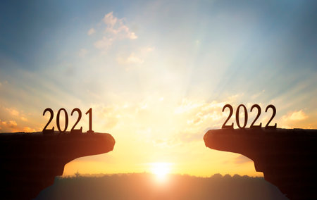2022 concept:2022 on the mountain at sunset backgroundの写真素材