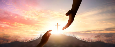 God's helping hand and cross on sunset backgroundの写真素材